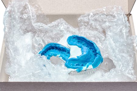 dental moulds wrapped in bubble wrap in box