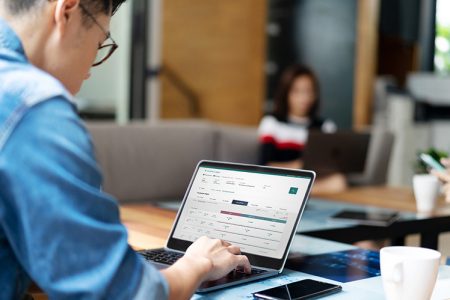 Man accessing Cathay website on laptop