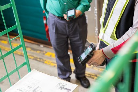 terminal staff scanning airway bill on box