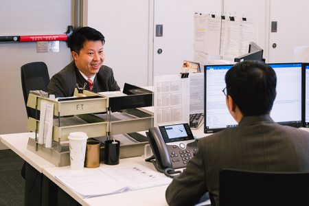 Henry Yu in office with colleague