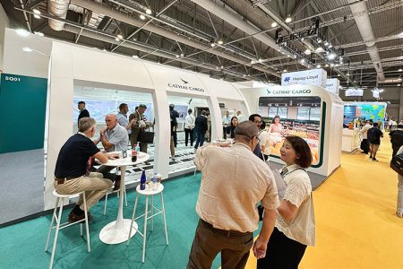 Visitors outside Cathay booth at trade show