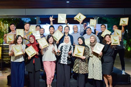 Group photo with top agents awards framed with gold Cathay logo shape