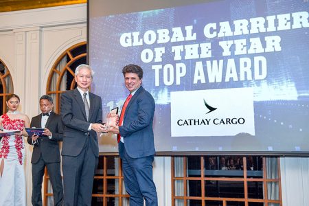 Ashish Kapur collecting award onstage