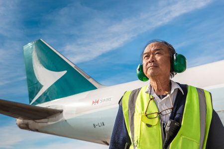 Jittarat Sukanthanag standing in front of Cathay aircraft