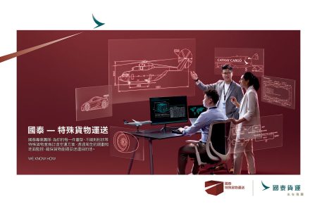 A group of people looking at a computer screen