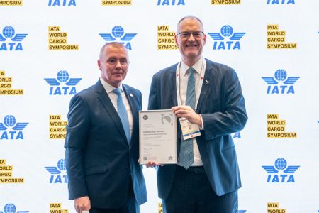 Cathay Cargo Terminal Chief Operating Officer Mark Watts collects the IEnvA certification from IATA Director General Willie Walsh