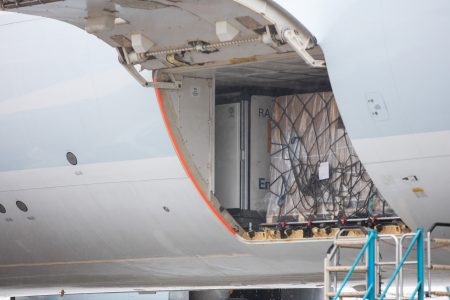 An opening door of a Cathay Cargo airplane