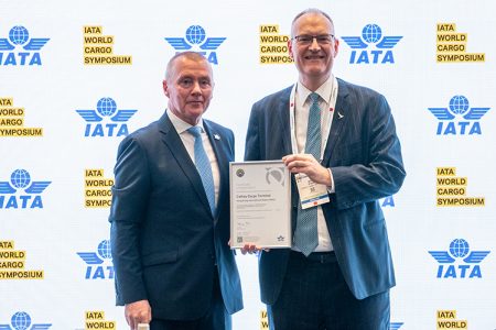 Cathay Cargo Terminal Chief Operating Officer Mark Watts (right)picking up the IEnvA accreditation from IATA Director-General Willie Walsh
