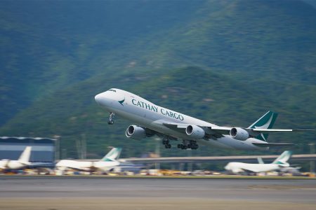 A Cathay Cargo Boeing 747-8F freighter takes off from Hong Kong International Airport