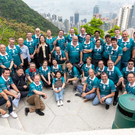 cathay cargo team taking a group picture at the peak