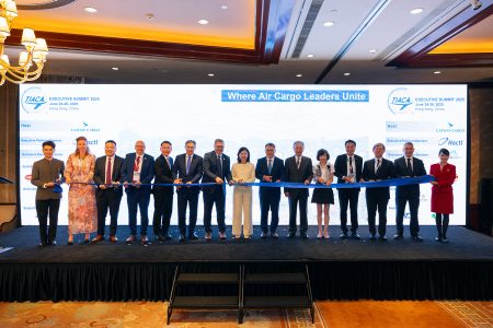 Executives, host sponsors and dignitaries cut the ribbon to officially open an event