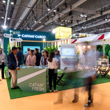 show visitors gather around the Cathay Cargo exhibition stand at Asia Fruit Logistica