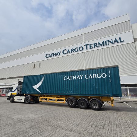 A Cathay Cargo-branded semi-truck outside the Cathay Cargo Terminal in Hong Kong