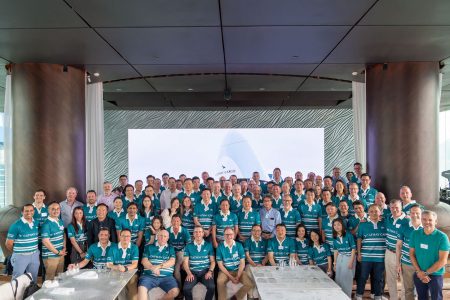 Cathay Cargo customers and staff gather for a group picture in their rugby tops at the Cathay Cargo Business Update