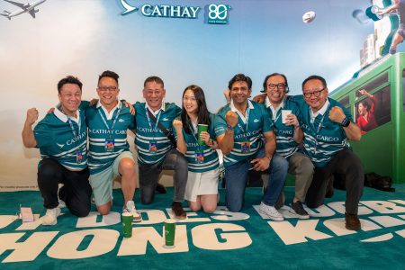 The Global Partnership team led by Siddhant Iyer (third from right) scrum down with customers at the stadium