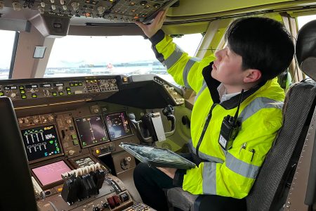 Chung checks the aircraft systems in the flight deck