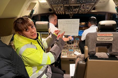 CSO Lorraine Bradford hands over the paperwork to the flight crew ahead of departure