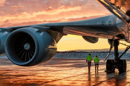 A Cathay Cargo Boeing 747 freighter on the open ramp area at Ted Stevens Anchorage International Airport at dusk