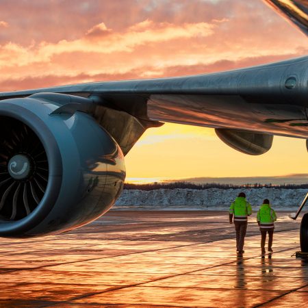 A Cathay Cargo Boeing 747 freighter on the open ramp area at Ted Stevens Anchorage International Airport at dusk