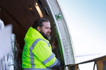 Cargo Services Lead Aaron Freeman gets ready to close the cargo door on a Cathay Cargo freighter