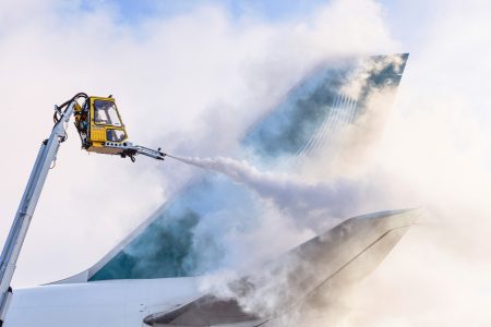 Low winter temperatures means that de-icing is routine activity on the ramp in Anchorage 