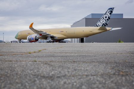 The first complete A350F, MSN 700, shuttles between hangars at Toulouse with its cargo door fitted