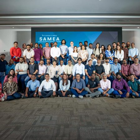 Cathay Cargo’s SAMEA team gathers for a group phot in a room