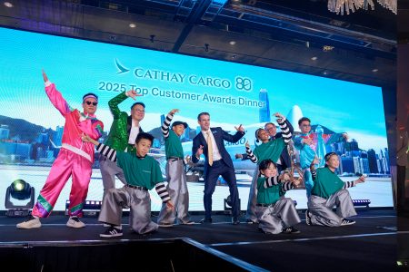 Head of Cargo Sales Hong Kong and the GBA, Frank Yau, leads two of his sales colleagues in a dance with the Funky Heroes troupe