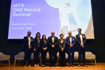 Panellists pose on stage at the ONE Record Seminar in the auditorium at Cathay City