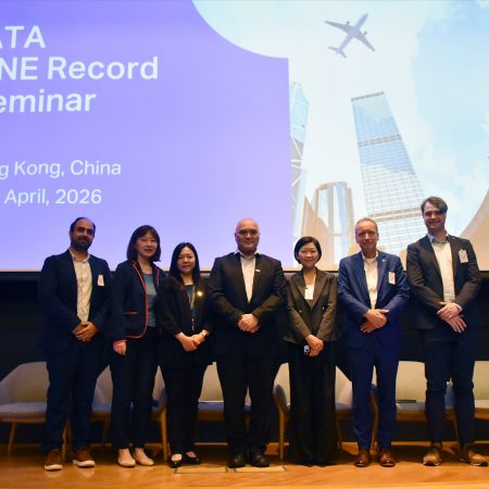 Panellists pose on stage at the ONE Record Seminar in the auditorium at Cathay City